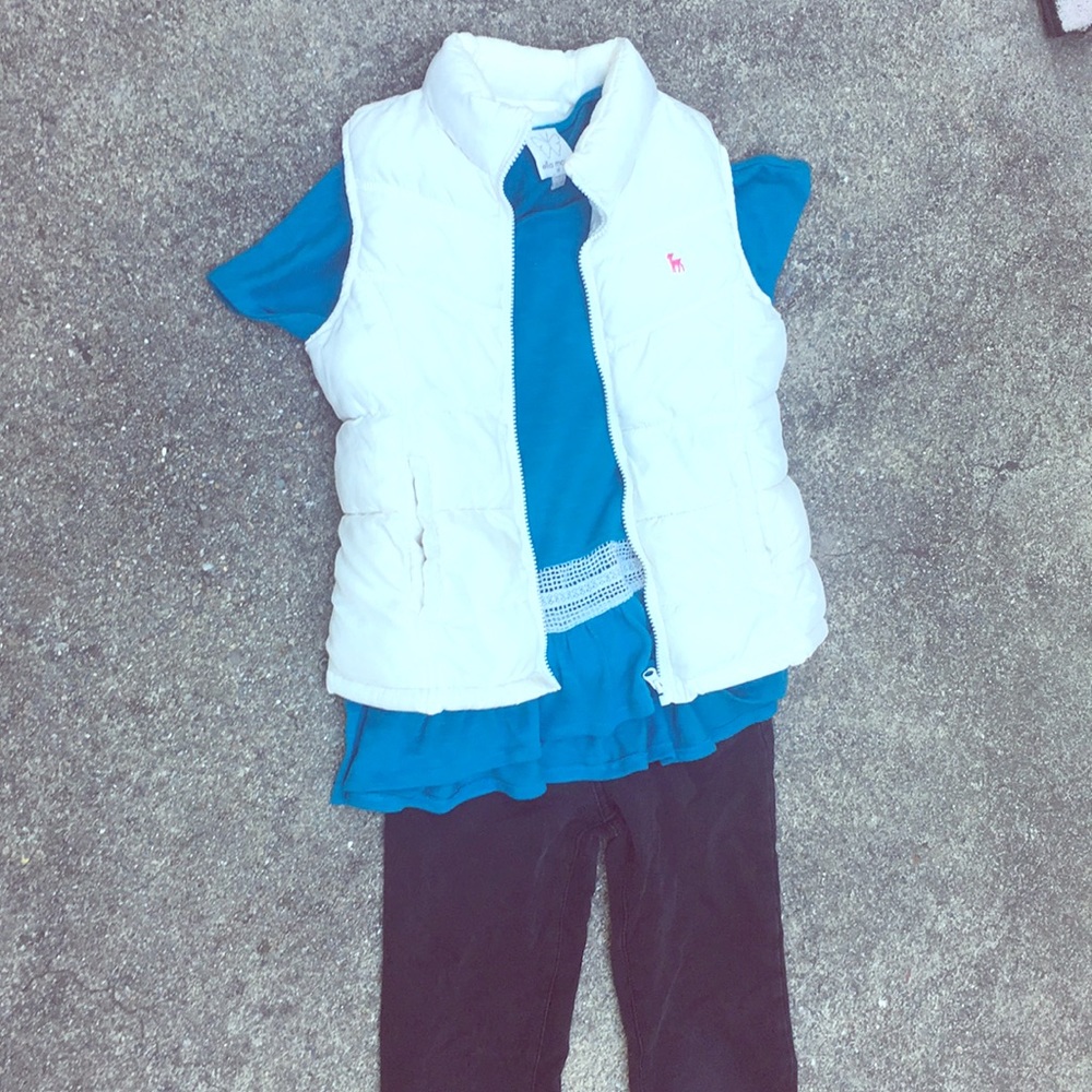T- shirt with jeans and a vest